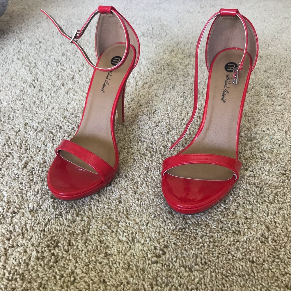 Never worn Michael Antonio red heels